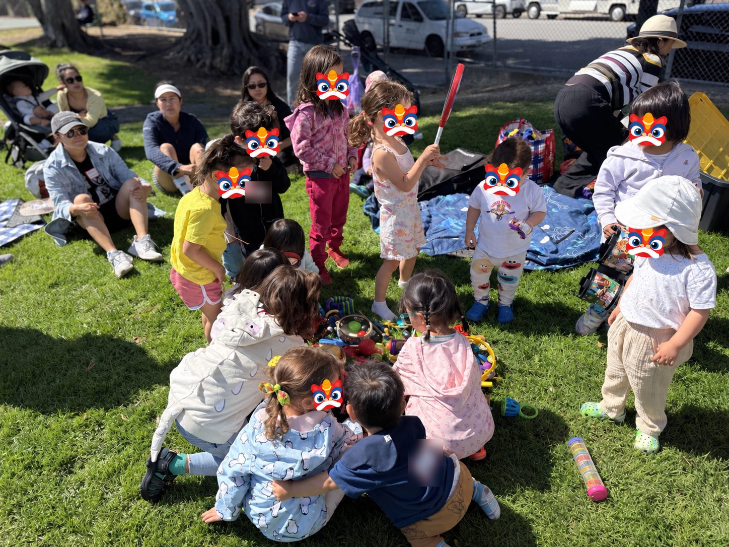 Kids gathered around a pile of instruments, playing together